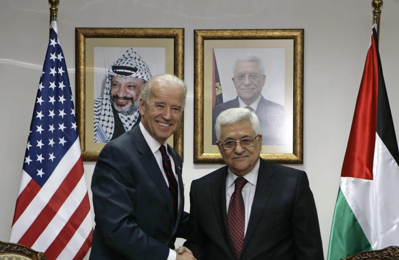 Then-vice president Joe Biden greets Palestinian Authority President Mahmoud Abbas in Ramallah on March 10, 2010. (photo credit: AMMAR AWAD/REUTERS)