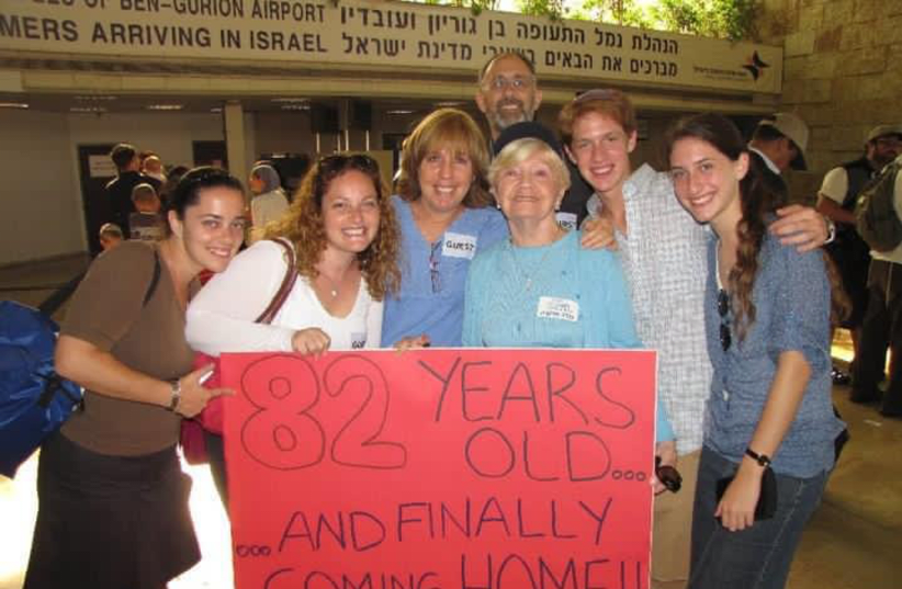 LEAH KLEIN, the writer’s mother, is welcomed by her family as she makes aliyah (photo credit: PNINA WEISS PERETZ)