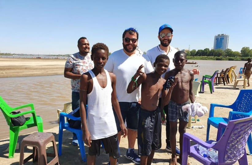 Having fun with some local Sudanese kids on the Nile River shores on Tuti Island in Khartoum (photo credit: Courtesy)