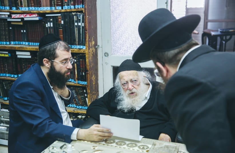 RABBI CHAIM KANIEVSKY speaks with students at his home in Bnei Brak in December. (photo credit: DAVID COHEN/FLASH 90)