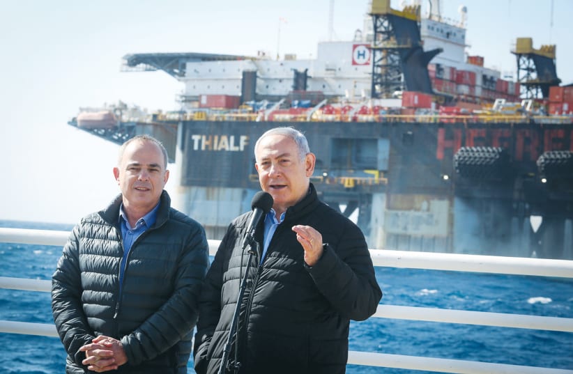 PRIME MINISTER Benjamin Netanyahu and Energy Minister Yuval Steinitz visit at the Leviathan gas field gas processing rig near Caesarea in 2019. (photo credit: MARC ISRAEL SELLEM/THE JERUSALEM POST)