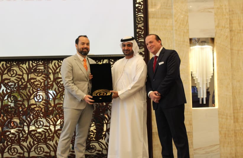 Sheikh Juma Bin Maktoum presents an award to DP World SVP Ryan Quinlan, alongside Dr. Raphael Nagel, founder of the Abrahamic Business Circle (photo credit: ABRAHAMIC BUSINESS CIRCLE)