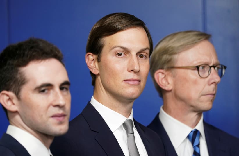 White House adviser Jared Kushner, flanked by aide Avi Berkowitz (L) and Brian Hook, former U.S. envoy to Iran, during a press briefing on the agreement between Israel and the United Arab Emirates at White House in Washington (photo credit: KEVIN LAMARQUE)