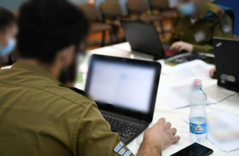 IDF cyber defenders are seen participating in an online international exercise. (photo credit: IDF)
