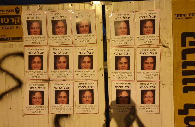 Activists from Lotem, an organization that seeks to fight 'gender-based terror,' and from activist group "Breaking Walls" hung posters with the face of Yuval Karmi, a psychologist accused of sexually assaulting his patients, in the Jerusalem neighborhood where he lives. (photo credit: Courtesy)