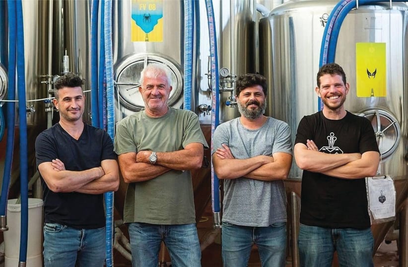 Team behind the four rare lemon beers brewed collaboratively by the BeerBazaar Brewery in Kiryat Gat and Klotsman Orchards in Emek Hefer (photo credit: ITIEL ZION)