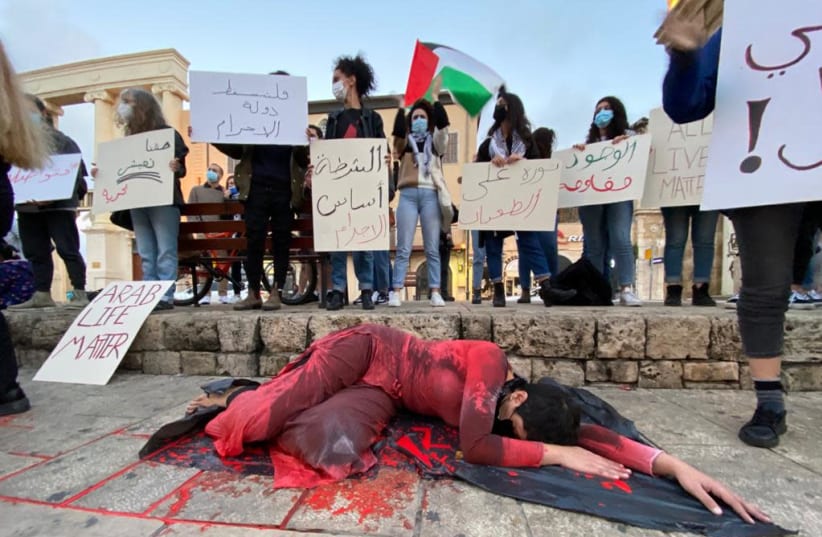 A protest against the rising crime and violence in the Arab sector in Israel, Jaffa, Saturday, February 6, 2021. (photo credit: SASSONI AVSHALOM)