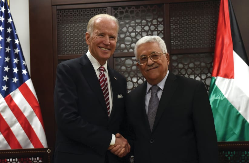 THEN-US VICE-PRESIDENT Joe Biden shakes hands with Palestinian Authority President Mahmoud Abbas in Ramallah in 2016. (photo credit: DEBBIE HILL/REUTERS)