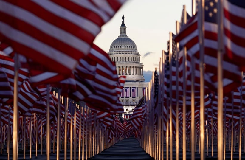 The "Field of flags" is seen on the National Mall in front of the US Capitol building ahead of inauguration ceremonies for President-elect Joe Biden in Washington, US, January 20, 2021. (photo credit: REUTERS/ALLISON SHELLEY)