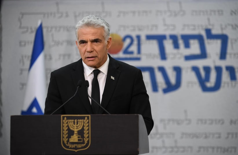 Yesh Atid leader Yair Lapid presents his party's plan for the elderly, February 7 ,2021 (photo credit: ELAD GUTMAN)