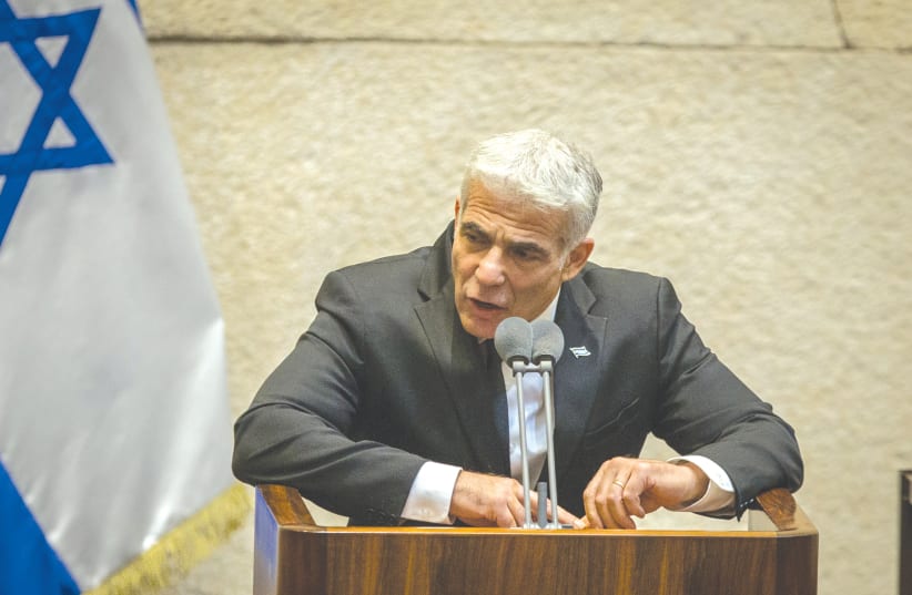 YESH ATID Party chairman MK Yair Lapid speaks in the Knesset in August. (photo credit: OREN BEN HAKOON/FLASH90)