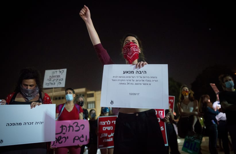 Activists protest against recent cases of violence against women at Habima square in Tel Aviv on October 21, 2020.  (photo credit: MIRIAM ALSTER/FLASH90)