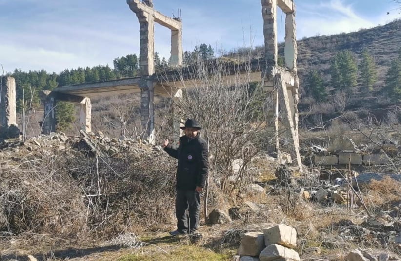 Rabbi Zamir Isayev is seen in front of the destroyed remnants of a hospital in Zangilan, a city liberated by Azerbaijan from Armenia. (photo credit: ZAMIR ISAYEV)