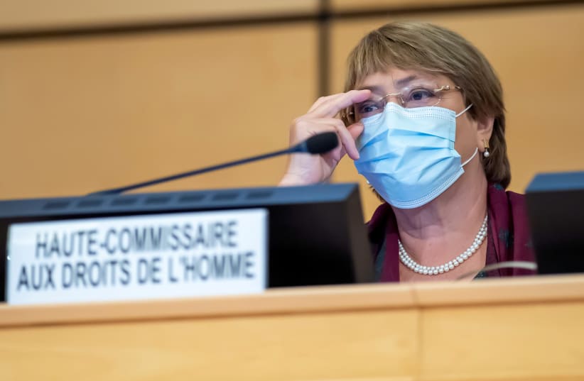 United Nations' High Commissioner for Human Rights Michelle Bachelet adjusts her glasses during the opening of 45th session of the Human Rights Council, at the European UN headquarters in Geneva, Switzerland September 14, 2020. (photo credit: MARTIAL TREZZINI/POOL VIA REUTERS)