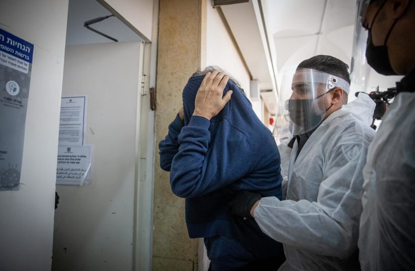 Yuval Carmi, a psychologist suspected of committing sexual offenses on at least one of his patients is brought in for a court hearing at the Jerusalem Magistrate's Court on January 28, 2021.  (photo credit: YONATAN SINDEL/FLASH 90)