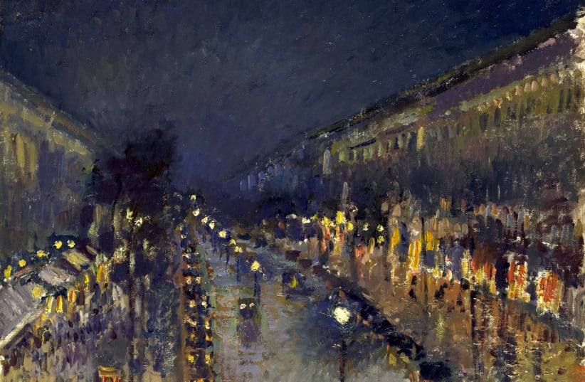 ‘The Boulevard Montmartre at Night’ by Camille Pissarro, on display at the National Gallery, London. (photo credit: WIKIPEDIA)