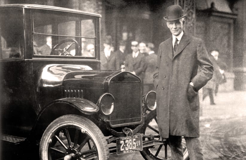HENRY FORD with a Model T, 1921. One can still easily purchase his century-old diatribe ‘The International Jew.’ (photo credit: Wikimedia Commons)