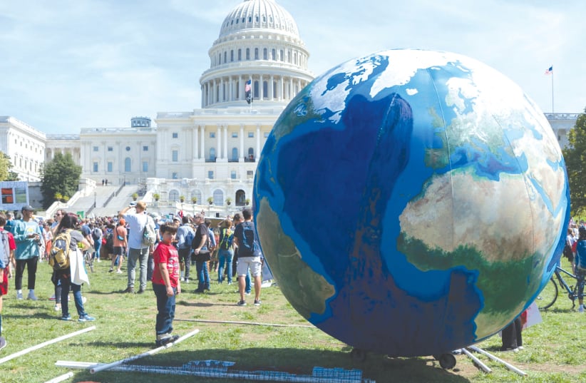 A PROTEST about the climate crisis outside the US Capitol in 2019. (photo credit: VICTORIA PICKERING/CREATIVE COMMONS)