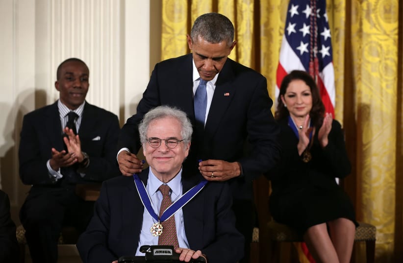 Violinist Itzhak Perlman, seen here receiving the US Presidential Medal of Freedom from President Barack Obama in November 2015, was among those participating in a Feb. 3, 2021, kickoff event for Jewish Disability Advocacy Month.  (photo credit: ALEX WONG/GETTY IMAGES/JTA)