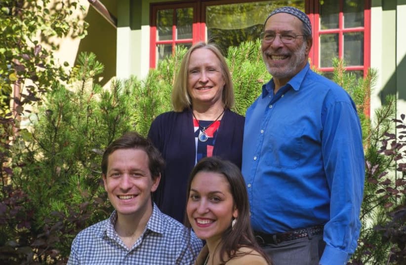 Rabbi Ed Stafman poses with his family in an undated campaign photo in Bozeman, Mont., in 2020. (Ed Stafman campaign) (photo credit: ED STAFMAN CAMPAIGN)