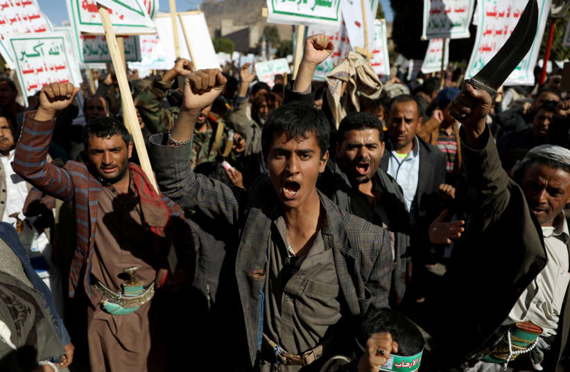 Houthi supporters shout slogans during a rally against the United States' designation of Houthis as a foreign terrorist organization, in Sanaa, Yemen January 25, 2021 (photo credit: REUTERS/KHALED ABDULLAH)
