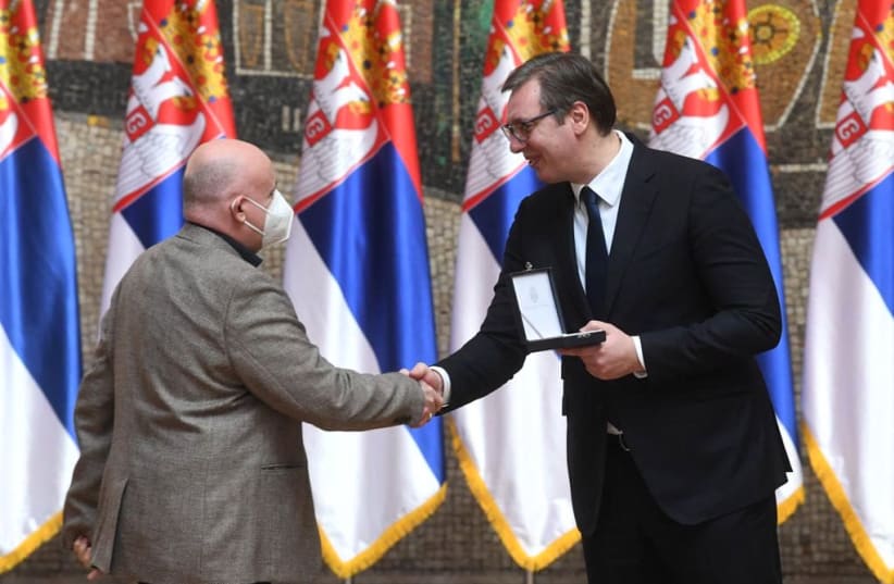 Serbian President Aleksandar Vučić bestowing an award to President of the UNS Vladimir Radomirović on Michael Freund's behalf. (photo credit: DIMITRIJE GOLL (OFFICE OF THE PRESIDENT OF SERBIA))