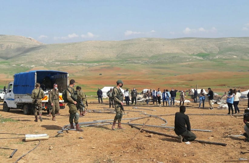 The Civil Administration confiscates tents at the site of the contested Humsa village in the Jordan Valley. (photo credit: AREF DARAGHMEH/B'TSELEM)