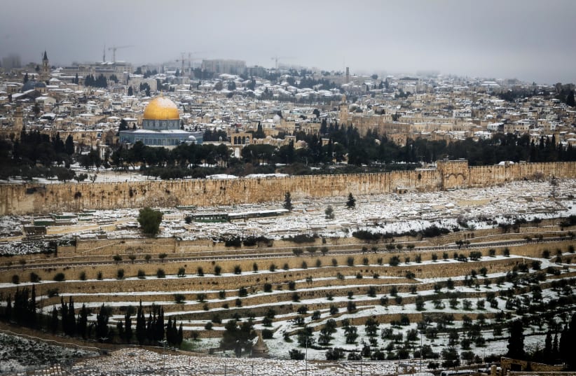 Snow view of the old city in Jerusalem, February 18, 2021 (photo credit: MARC ISRAEL SELLEM)