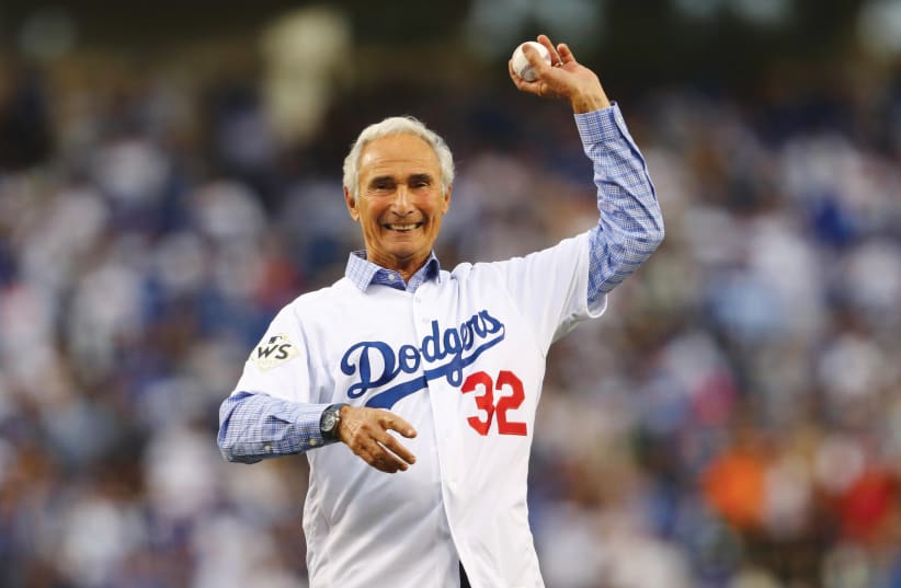 LEGENDARY LA Dodgers pitcher Sandy Koufax throws out the first pitch at the 2017 World Series. Derfner says his friends would not have loved the Jewish Koufax had he not been a star. (photo credit: TIM BRADBURY/POOL PHOTO VIA USA TODAY SPORTS)
