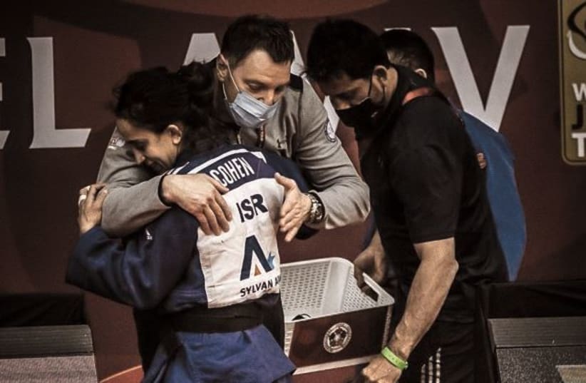 ISRAELI JUDOKA Gili Cohen celebrates after winning a silver medal yesterday in the <52 kg division at the Tel Aviv Grand Slam to secure her spot in the Olympics. (photo credit: ISRAEL JUDO ASSOCIATION)
