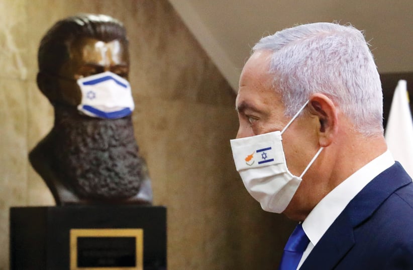 PRIME MINISTER Benjamin Netanyahu at his office on Sunday. Vaccines have been a dominant theme in Likud campaign materials and in Netanyahu’s recent interviews. (photo credit: MARC ISRAEL SELLEM/THE JERUSALEM POST)