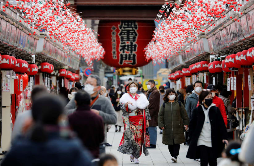A woman wearing kimono makes her way at Asakusa district, amid the coronavirus disease (COVID-19) outbreak, in Tokyo, Japan (photo credit: REUTERS/KIM KYUNG-HOON)