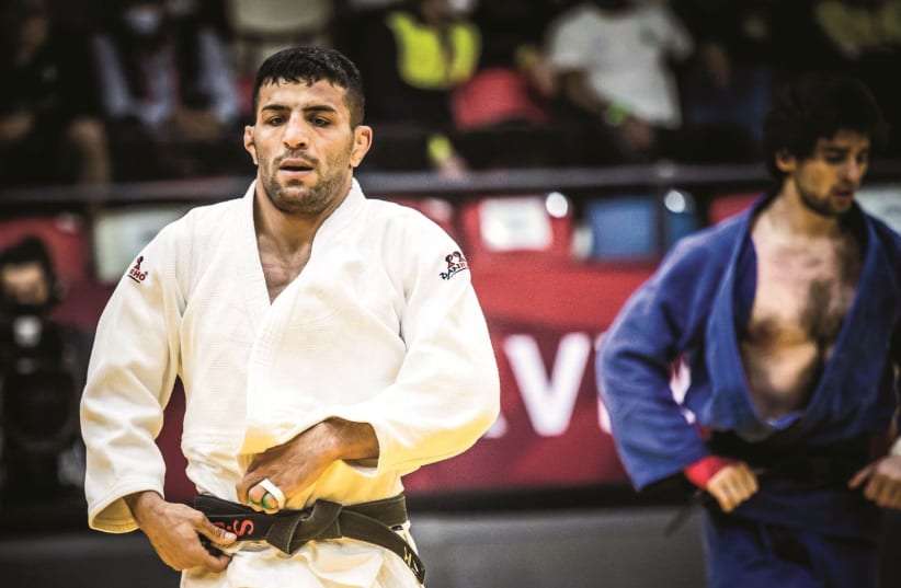 IRANIAN SAIEID MOLLAEI, who fled his country after ignoring orders to drop out of a match in 2019 to avoid facing Israeli judoka Sagi Muki, won a silver medal over the weekend at the Tel Aviv Grand Slam at the Drive-In Arena. (photo credit: ODED KARNI/ISRAEL JUDO ASSOCIATION)