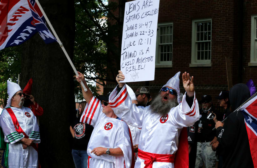 Members of the Ku Klux Klan rally in support of Confederate monuments in Charlottesville, Virginia, US, July 8, 2017 (photo credit: REUTERS/JONATHAN ERNST)