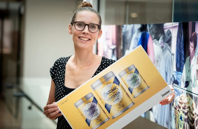 Renee Pater presents the design for the new label that her company, Patisserie Pater, produces in Zwaagdijk, the Netherlands.  (photo credit: PATISSERIE PATER)