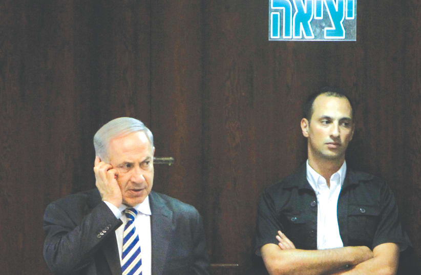 PRIME MINISTER Benjamin Netanyahu on a cellphone - ‘the president is calling.’ (photo credit: MIRIAM ALSTER/FLASH90)