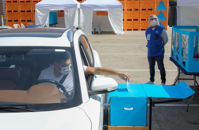 Drive-by voting in the Israeli election amid the coronavirus pandemic 2021 (photo credit: MARC ISRAEL SELLEM)