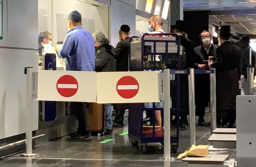 Israeli passengers wait to board the Lufthansa flight intended to bring them back to Israel, February 24, 2021.  (photo credit: ALANA RUBEN)