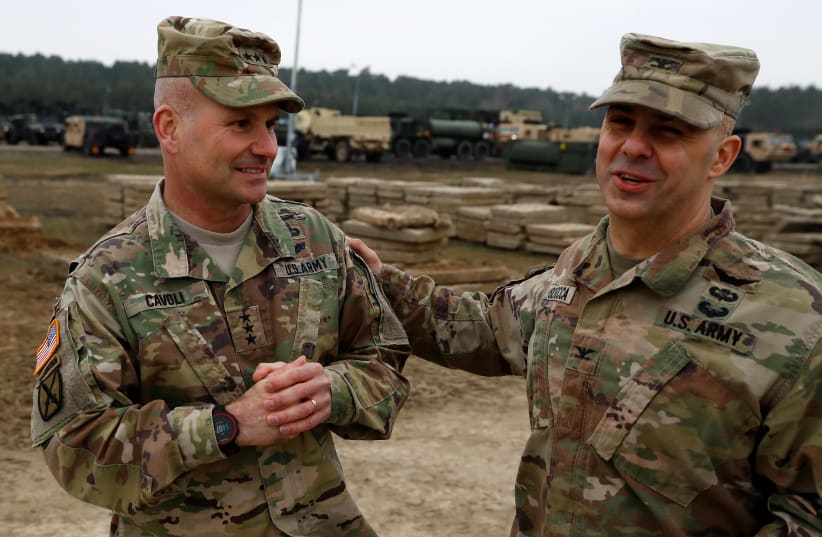 US Army Europe Commander Christopher Cavoli and US Army Europe Director of Public Affairs Joe Scrocca attend a media briefing after deployment of US troops from 2nd Armored Brigade Combat Team, 1st Armored Division for military exercises in Drawsko Pomorskie training area, Poland March 21, 2019.  (photo credit: REUTERS/KACPER PEMPEL)