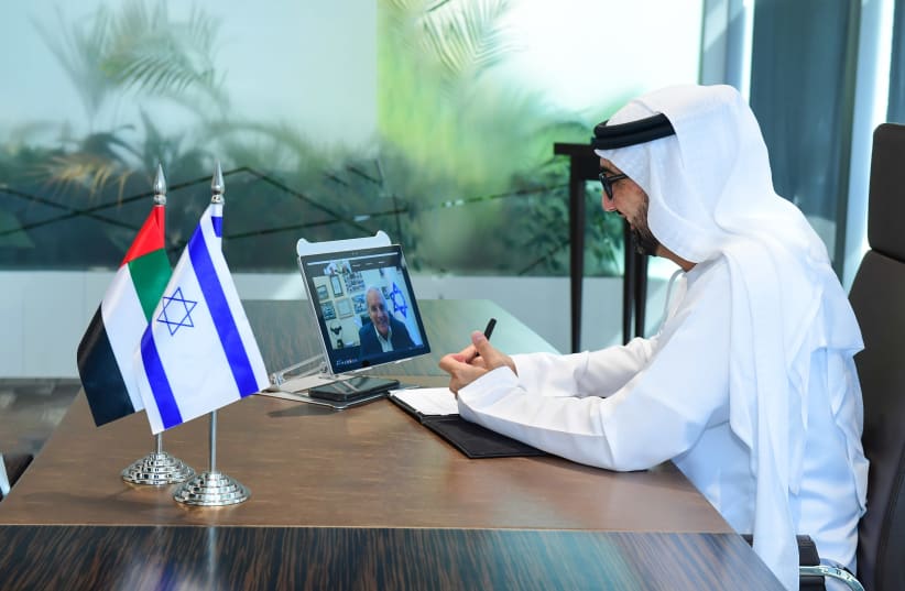 H.E. Dr. Tariq Bin Hendi signs cooperation agreement virtually with David Leffler, Director General Ministry of Economy and Industry of Israel.  (photo credit: Courtesy)
