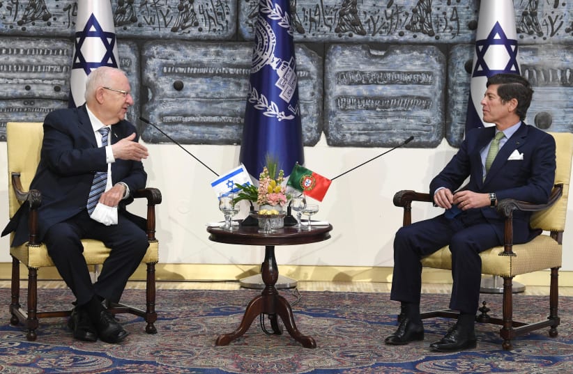 President Reuven Rivlin is seen meeting with Portugal's Ambassador to Israel Jorge Tito de Vasconcelos Nogueira Dias Cabral at the President's Residence, on February 24, 2021. (photo credit: MARK NEYMAN/GPO)