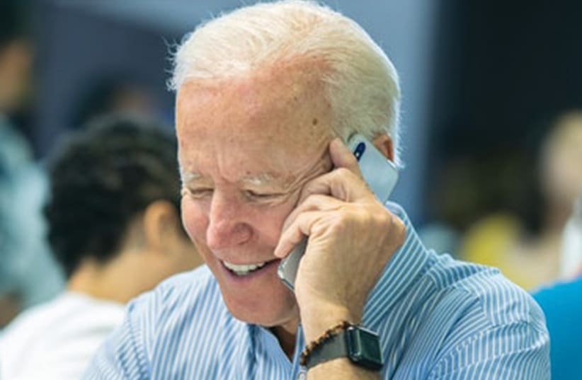 PRESIDENT JOE BIDEN makes a phone call. (photo credit: COMPOSITE PHOTO BY OLGA LEVI/REUTERS/FLASH90/WIKIM)