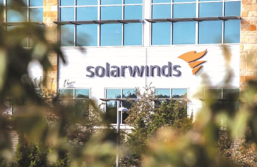 THE SOLARWINDS logo is seen outside its headquarters in Austin, Texas, in December. (photo credit: REUTERS/SERGIO FLORES)