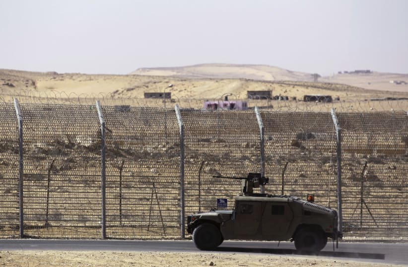 Armoured Israeli military vehicle driving along border with Egypt (photo credit: AMIR COHEN/REUTERS)