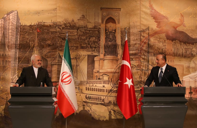 Iranian Foreign Minister Javad Zarif attends a news conference with his Turkish counterpart Mevlut Cavusoglu in Istanbul, Turkey, January 29, 2021 (photo credit: TURKISH FOREIGN MINISTRY /HANDOUT VIA REUTERS)