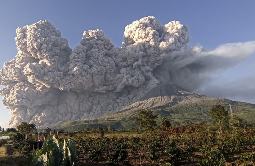 Mount Sinabung volcano erupts as seen from Kuta Rakyat village in Karo (photo credit: REUTERS)