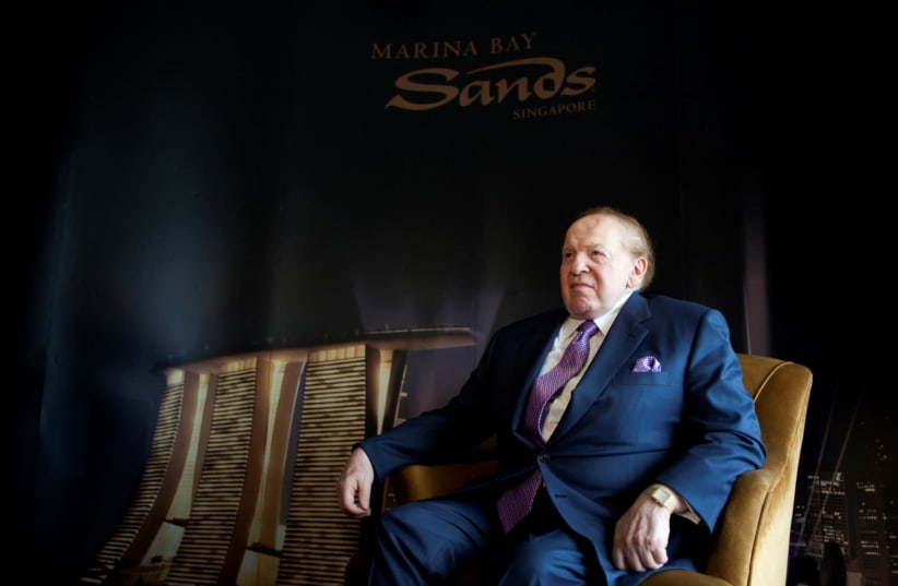 Las Vegas Sands Chairman Sheldon Adelson sits down before an interview with Reuters in Singapore July 8, 2009. (photo credit: REUTERS)