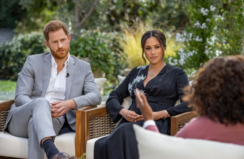 Britain's Prince Harry and Meghan, Duchess of Sussex, are interviewed by Oprah Winfrey in this undated handout photo. (photo credit: HARPO PRODUCTIONS/JOE PUGLIESE/HANDOUT VIA REUTERS)
