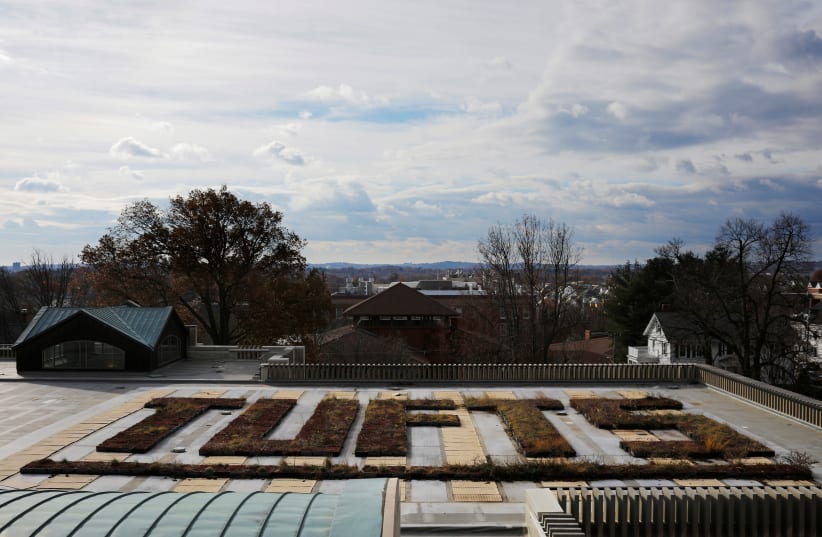 Plants in beds spell out the school's name on the roof of the library at Tufts University in Medford, Massachusetts, US, November 27, 2017.  (photo credit: REUTERS/BRIAN SNYDER)
