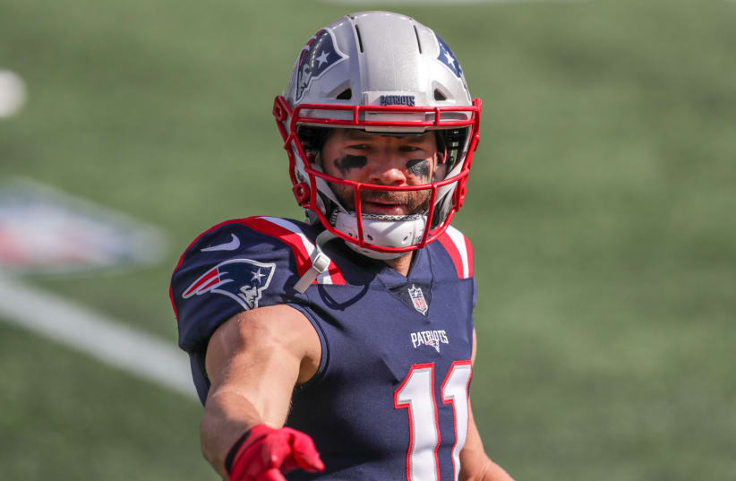 New England Patriots receiver Julian Edelman (11) warms up prior to the game against the Denver Broncos at Gillette Stadium. (photo credit: PAUL RUTHERFORD / USA TODAY)
